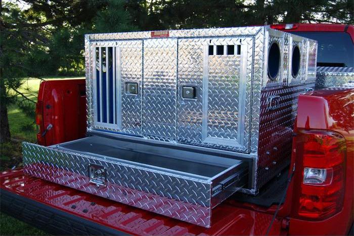 Dog Box - Owens Hunter aluminum double dog box for truck in back of red pickup truck